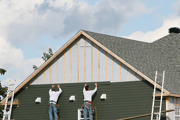 Professional Siding Repair technician working in West Sayville, NY